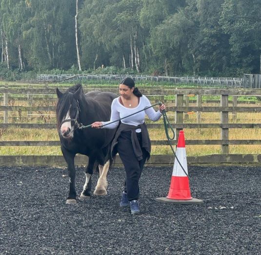 Cherelle Jones leading a horse